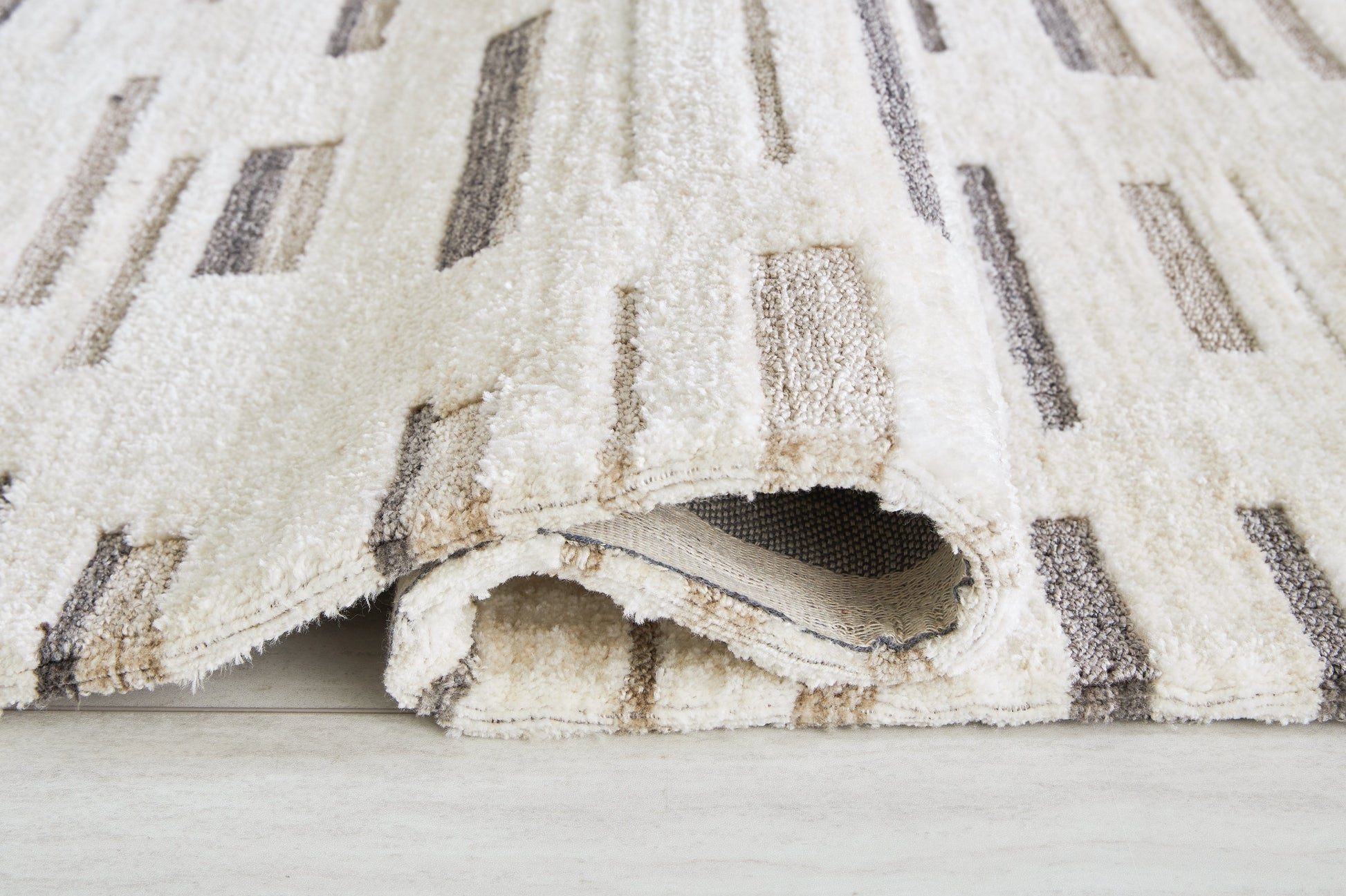 Leesdale Ivory/Brown/Black 5' x 7' Rug - R406422 - Luna Furniture - Dallas Store